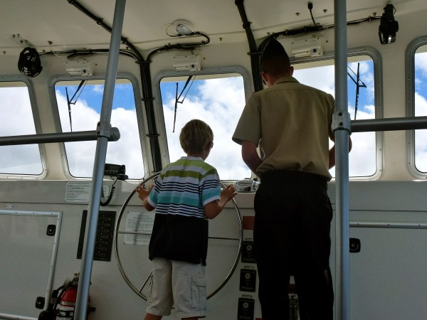 Pearl Harbor tour Our private guide arranged for my son to drive the boat back from the USS Arizona...Priceless